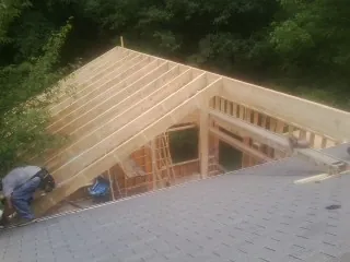 Framing a new roof addition that ties into an existing shingle roof in Armuchee